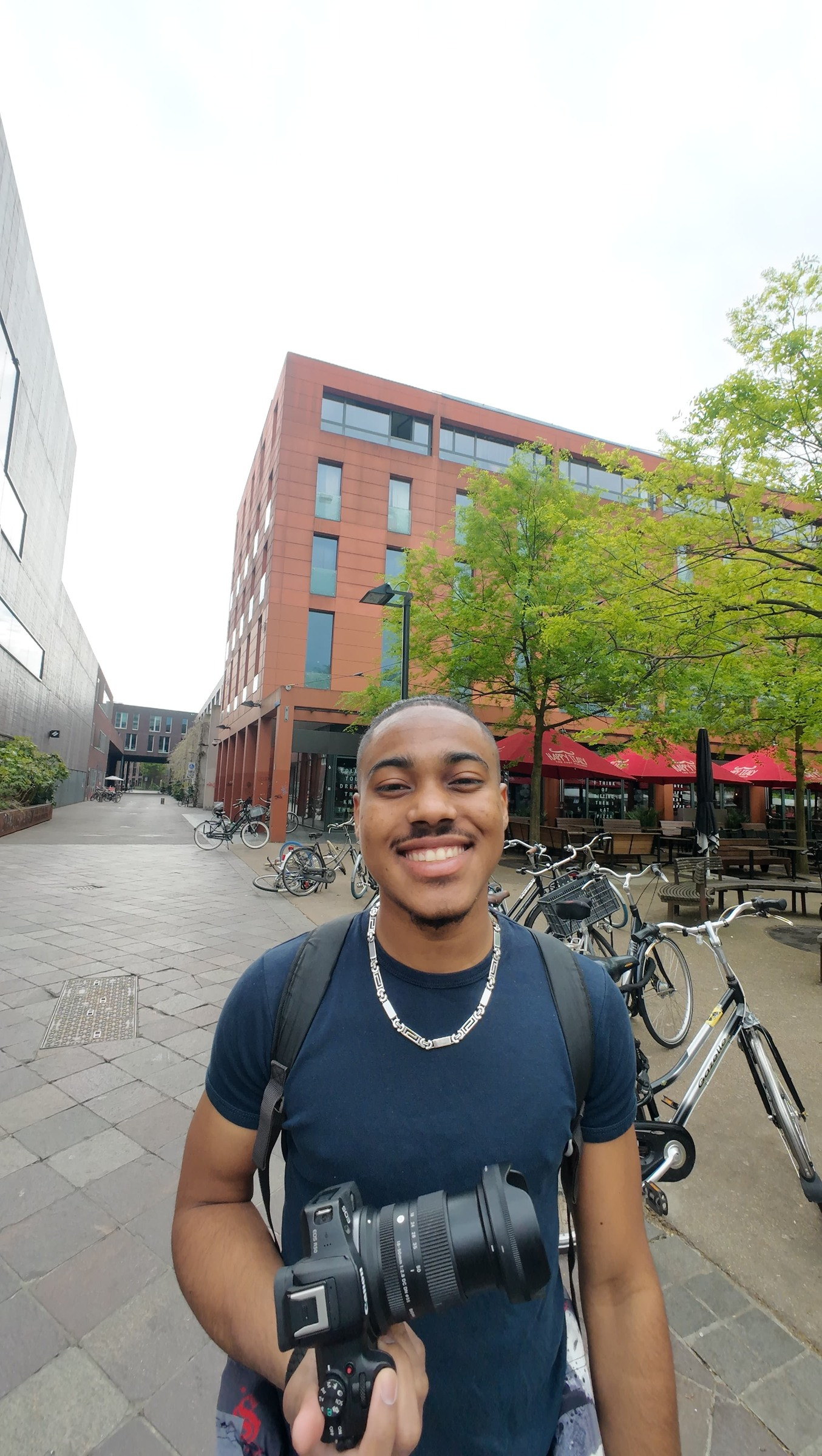Jaïr Pietersz with a camera during a photo moment in Eindhoven.
