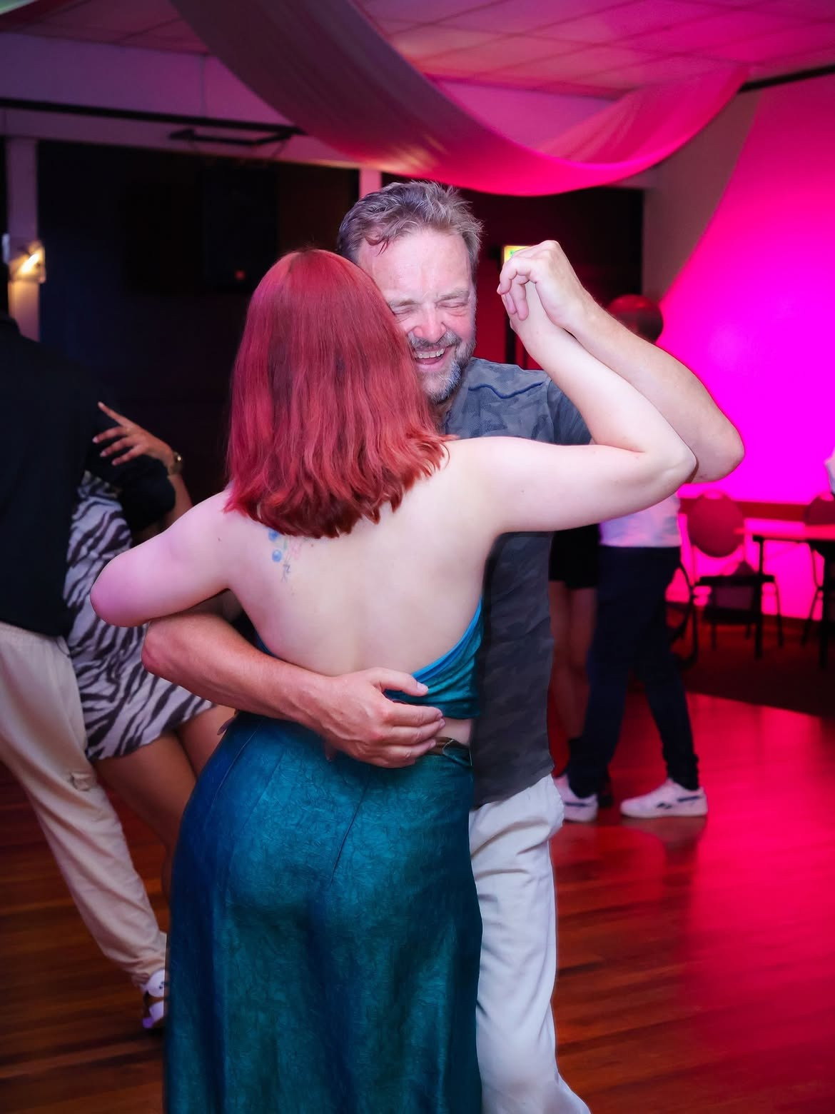 Dance moment on the dance floor photographed by JP Captivated.